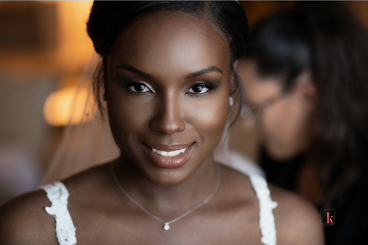 Close-up of bride with luminous skin and soft smoky eye