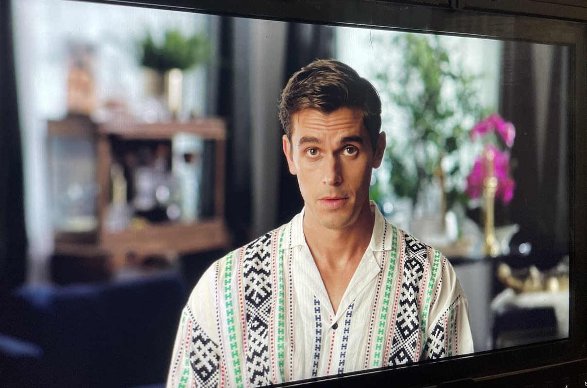 On-camera still of male talent groomed for series production