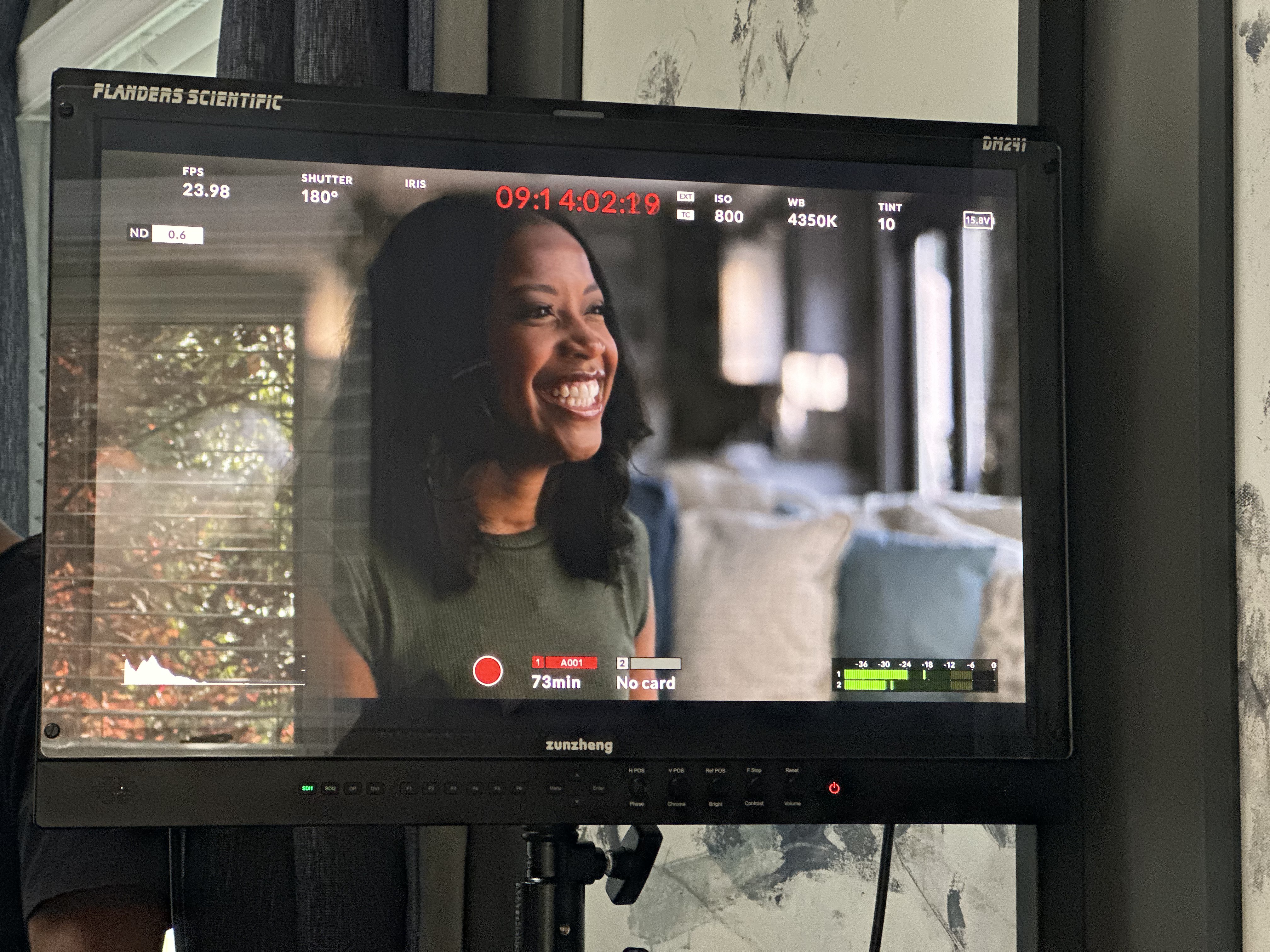 Director's monitor showing a smiling female talent on camera