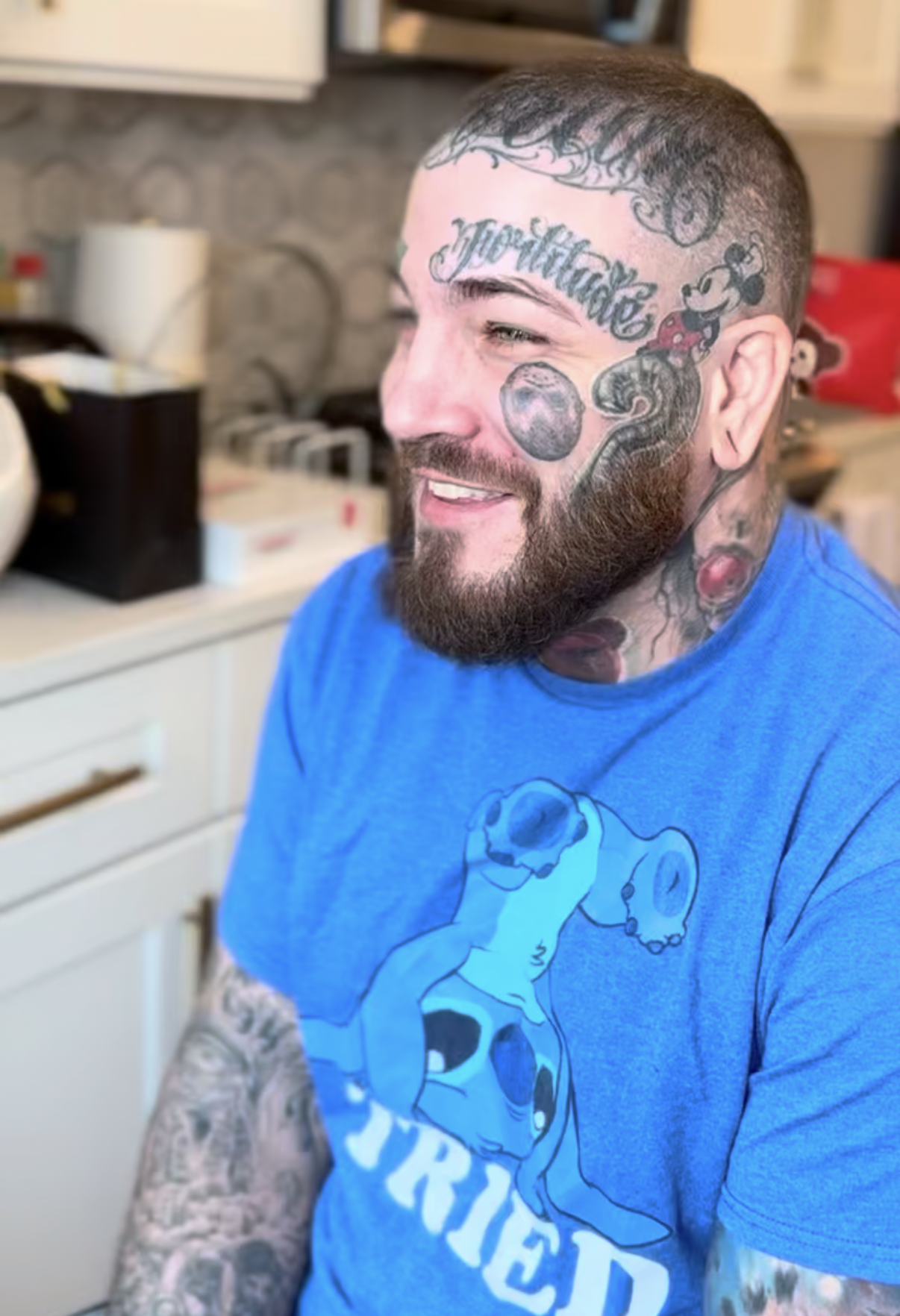 Client with face and neck tattoos before coverage
